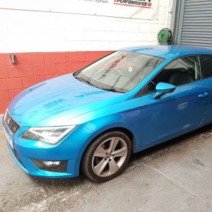 2013-seat-leon-150-in-front-of-shutter