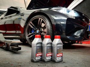 black-bmw-m2-with-oil