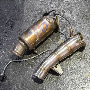 m2nvm-stock-downpipe-vs-new-downpipe